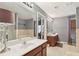 Bathroom with a double vanity, soaking tub and french doors at 1600 Yukon Ct, Atlanta, GA 30349