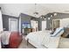 Large bedroom with vaulted ceilings, a ceiling fan, and a door to the outside at 1600 Yukon Ct, Atlanta, GA 30349