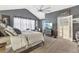 The spacious bedroom has high ceilings and a door to the primary bath at 1600 Yukon Ct, Atlanta, GA 30349