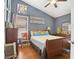 Bedroom featuring a bed with superhero decor, wooden floors, and bright natural light at 1600 Yukon Ct, Atlanta, GA 30349