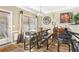 Cozy dining area featuring a wooden table, bench seating and sliding glass doors to patio at 1600 Yukon Ct, Atlanta, GA 30349