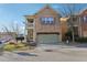Charming two-story brick home featuring a front-entry garage and an inviting second story balcony at 1600 Yukon Ct, Atlanta, GA 30349