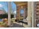 Inviting front porch features decorative columns, space for seating and a glass front door at 1600 Yukon Ct, Atlanta, GA 30349