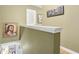 Upper hallway featuring neutral walls and artwork at 1600 Yukon Ct, Atlanta, GA 30349