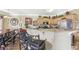 A view of the Kitchen with a breakfast bar, wooden cabinets, modern appliances, and stylish decor at 1600 Yukon Ct, Atlanta, GA 30349