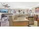 An open kitchen layout featuring granite counters, stainless steel appliances, and a view of the living room at 1600 Yukon Ct, Atlanta, GA 30349