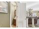 View of doorway to half-bathroom adjacent to living room with vanity and tile flooring at 1600 Yukon Ct, Atlanta, GA 30349