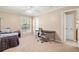 Bright bedroom with neutral walls, carpeted floors, a bed, and a desk near a window at 3200 Seven Pines Ct # 4, Atlanta, GA 30339