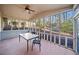 Relaxing screened porch featuring a ceiling fan and views of the serene backyard at 6817 Knollwood Dr, Douglasville, GA 30135