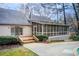 Backyard view with a screened-in porch, deck, and sliding glass doors to the residence at 925 Ivy Falls Dr, Atlanta, GA 30328