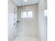 Modern shower with glass door and neutral tile at 925 Ivy Falls Dr, Atlanta, GA 30328