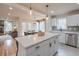 Bright kitchen with white cabinets, stainless steel appliances and central island at , Marietta, GA 30068