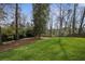 Green backyard with mature trees offers serenity and privacy at 1445 Ashwoody Ne Ct, Atlanta, GA 30319