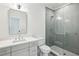 Bright bathroom featuring herringbone tile shower, sleek vanity, and modern fixtures at 1445 Ashwoody Ne Ct, Atlanta, GA 30319