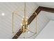 Chandelier with vaulted ceiling and wooden beam accents at 1445 Ashwoody Ne Ct, Atlanta, GA 30319