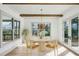 Bright dining room with a round table, decorative chandelier, and plenty of natural light at 1445 Ashwoody Ne Ct, Atlanta, GA 30319