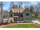 Stunning exterior view of home with green siding, stone accents, and a well-manicured lawn at 1445 Ashwoody Ne Ct, Atlanta, GA 30319