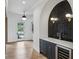 Hallway leading to door, showcasing sleek cabinets, a sink, and a wine cooler at 1445 Ashwoody Ne Ct, Atlanta, GA 30319