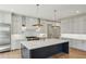 Modern kitchen features an island, stainless steel appliances, and elegant cabinetry at 1445 Ashwoody Ne Ct, Atlanta, GA 30319