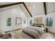 A spacious main bedroom featuring vaulted ceilings, wooden beams, and plenty of natural light at 1445 Ashwoody Ne Ct, Atlanta, GA 30319