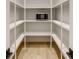 Organized pantry featuring floor to ceiling shelving and light hardwood floors at 1445 Ashwoody Ne Ct, Atlanta, GA 30319