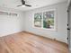 Sunlit bedroom featuring hardwood floors, large windows, and fresh white paint at 1788 Piper Se Cir, Atlanta, GA 30316