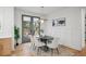 Elegant dining area with a modern light fixture, backyard view, and stylish wall decor at 1788 Piper Se Cir, Atlanta, GA 30316