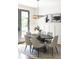 Elegant dining area with a sleek table, comfortable chairs, and contemporary light fixture at 1788 Piper Se Cir, Atlanta, GA 30316