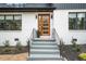 Exterior of home featuring front door, black framed windows, and painted brick at 1788 Piper Se Cir, Atlanta, GA 30316