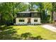 Charming home boasting modern design elements, lush green lawn, and inviting curb appeal at 1788 Piper Se Cir, Atlanta, GA 30316