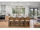 Modern kitchen with a large island, stylish bar stools, and high-end stainless steel appliances at 1788 Piper Se Cir, Atlanta, GA 30316