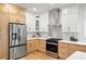 Spacious eat-in kitchen features stainless steel appliances, custom cabinetry, and stone countertops at 1788 Piper Se Cir, Atlanta, GA 30316