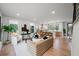 Open-concept living space with hardwood floors, bright interior, and seamless kitchen access at 1788 Piper Se Cir, Atlanta, GA 30316