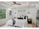 Spacious main bedroom with tray ceilings, large windows, hardwood floors and modern furnishings at 1788 Piper Se Cir, Atlanta, GA 30316