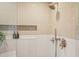 Modern shower featuring sleek bronze fixtures, a handheld sprayer, and tiled walls at 1788 Piper Se Cir, Atlanta, GA 30316