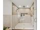 Modern walk-in shower featuring dual shower heads, tiled walls, and a glass enclosure for a luxurious bathing experience at 1788 Piper Se Cir, Atlanta, GA 30316