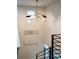 Modern staircase with black metal railings and natural wood steps, complemented by stylish lighting and artwork at 1788 Piper Se Cir, Atlanta, GA 30316