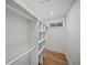Walk-in closet with custom shelving and hardwood floors at 1788 Piper Se Cir, Atlanta, GA 30316