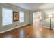 Bright and airy living room with hardwood floors and large windows at 1849 Linnet Ne Ct, Roswell, GA 30075