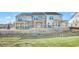 New construction townhomes featuring brick facade and covered back patios at 5619 Tillman Way, Powder Springs, GA 30127
