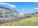 New construction townhouse featuring patio, brick facade, and retaining wall at 5619 Tillman Way, Powder Springs, GA 30127