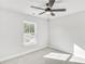Cozy bedroom with ceiling fan, neutral carpet, and a window at 5619 Tillman Way, Powder Springs, GA 30127