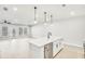 Open kitchen with stainless steel appliances and spacious island at 5619 Tillman Way, Powder Springs, GA 30127