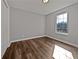 Bedroom features hardwood floors, closet and a large window at 99 Cedars Glen Way, Villa Rica, GA 30180