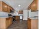Modern kitchen with stainless steel appliances, wood cabinets, and granite countertops at 99 Cedars Glen Way, Villa Rica, GA 30180