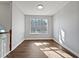Cozy room with lots of light streaming in through a large window at 99 Cedars Glen Way, Villa Rica, GA 30180