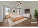 Staged main bedroom featuring a tray ceiling and two large windows at 99 Cedars Glen Way, Villa Rica, GA 30180