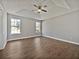 Main bedroom featuring a tray ceiling and two large windows at 99 Cedars Glen Way, Villa Rica, GA 30180