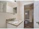 Bathroom features granite vanity top, neutral walls, and framed mirror at 1146 Canal St, Decatur, GA 30032