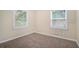 Bedroom features natural lighting from two windows and plush carpeting at 1146 Canal St, Decatur, GA 30032